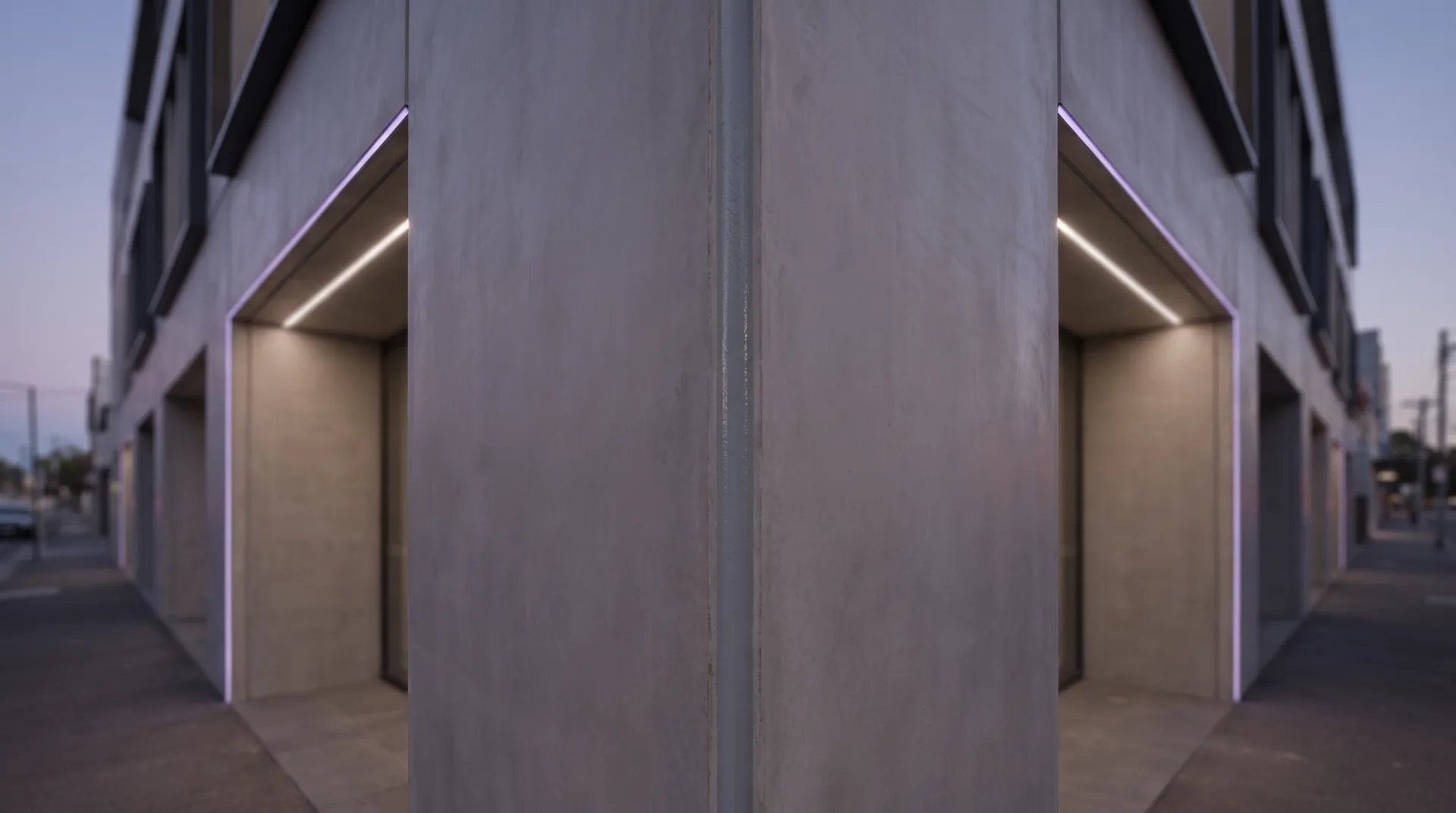 Modern Melbourne commercial building corner at dusk with a clean sealed vertical expansion joint