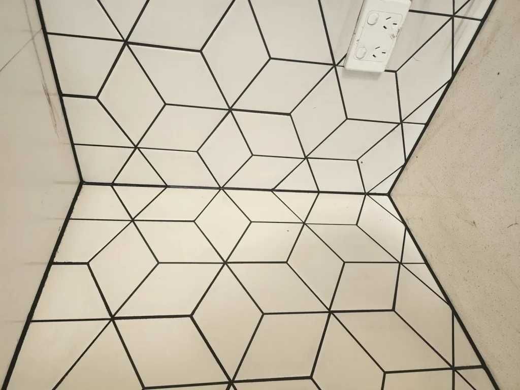 Diamond-pattern tiled kitchen floor with neat black grout lines, Melbourne