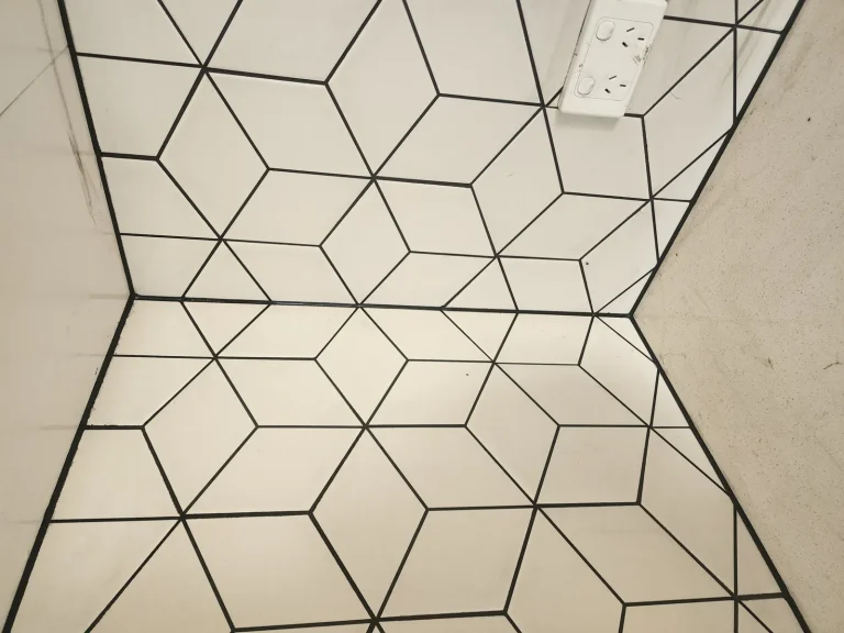Diamond-pattern tiled kitchen floor with neat black grout lines, Melbourne