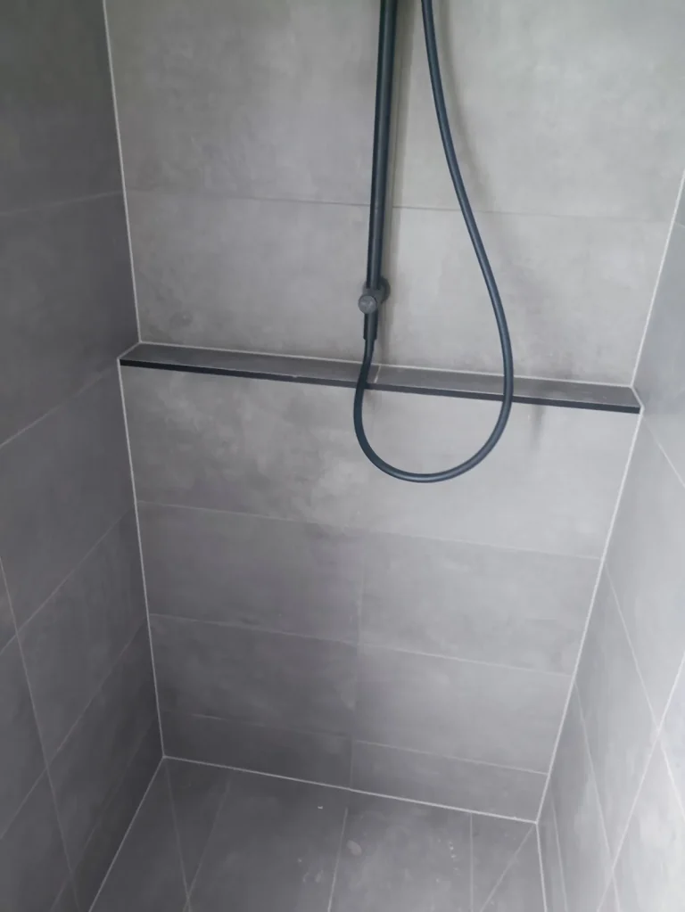 Tiled shower niche with precise caulked edges, Melbourne bathroom
